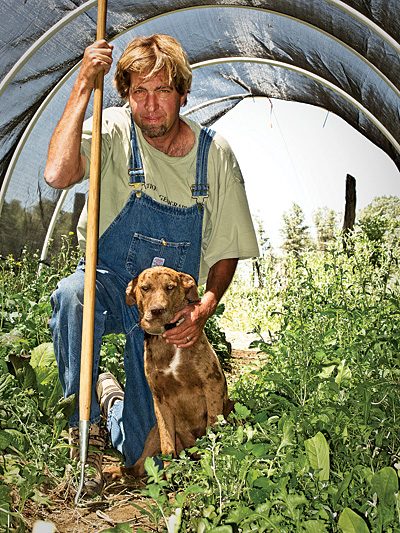 farmer and dog in field