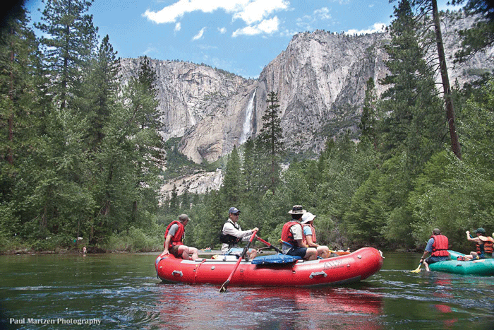 Rafts float past Yosemite Falls. Photo: Paul Martzen