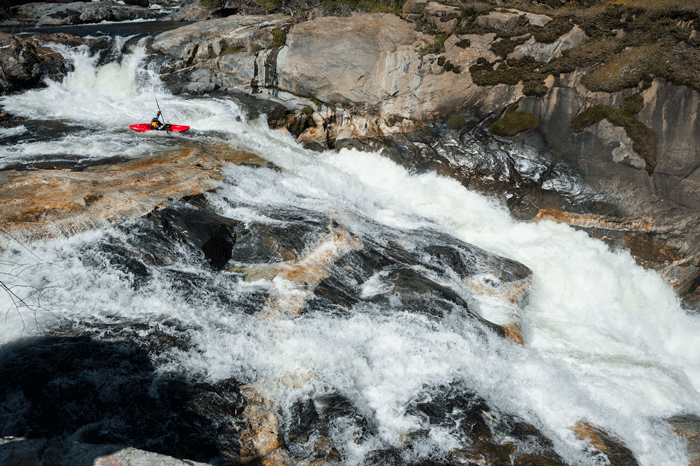 Laura Farrell opts to run the infamously named Nikki Kelly Slide right side up, Dinkey Creek. Photo: Darin McQuoid