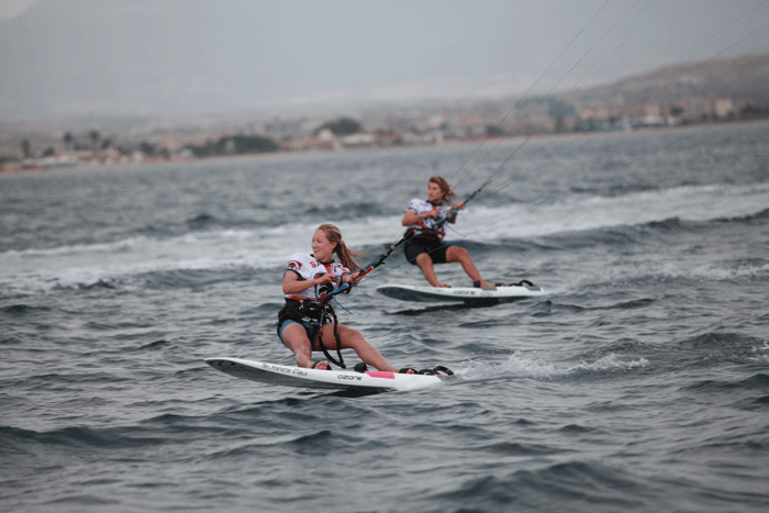 Erika and Johnny sailing a lap after winning the men's and women's 2012 World Championships. Photo: Roberto Foresti