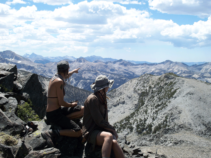 Pointing out distant peaks between Purple Lake and Duck Pass (Daniel Kangas).