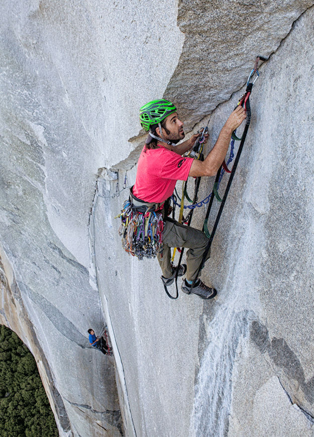 Dave setting a cam hook on day six. Fast and efficient aid climbing was crucial for success. Photo: Gabriel Mange