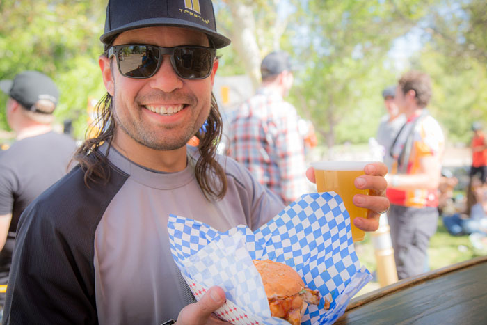Local rider Sam Hancock enjoys a well deserved sandwich and beer after a solid race that landed him in the top spot in his category.