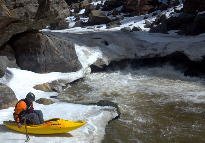 Crocket and his axe after portaging a frozen rapid (Brian Banks).