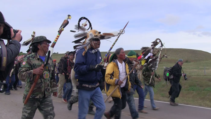 Elders leading a march from Oceti Sakowin camp to the front line camp along Highway 1806 (Lakota People’s Law Project).