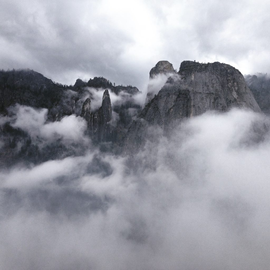 beBeautiful black and white photo of Yosemite peaks with clouds. Stewardship during COVID-19