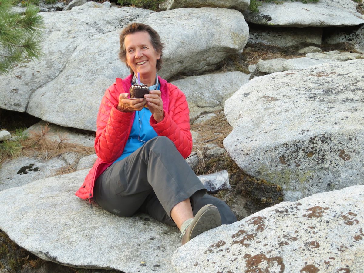 Photo of Dierdre Wolownick enjoying a cupcake at the top of El Capitan