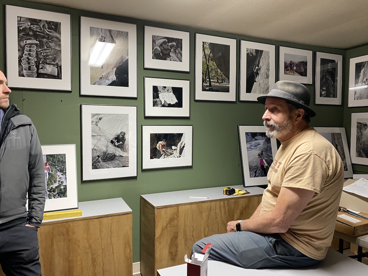 Photo of YCA founder, Ken Yager, looking at photos in the Yosmite Climbing Museum