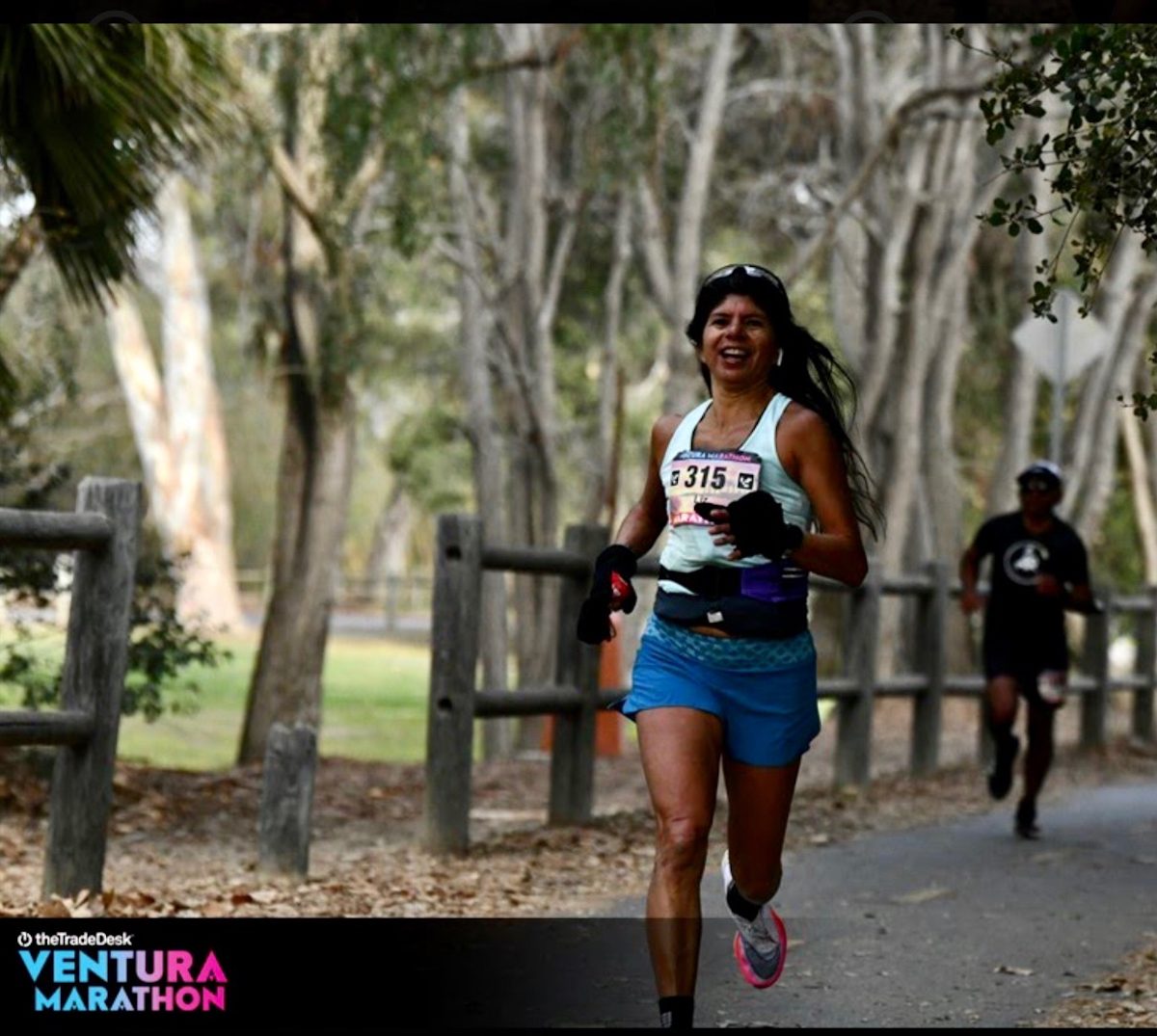 Liz Zaragoza Guerrini manages a smile while racing in the Ventura Half Marathon.