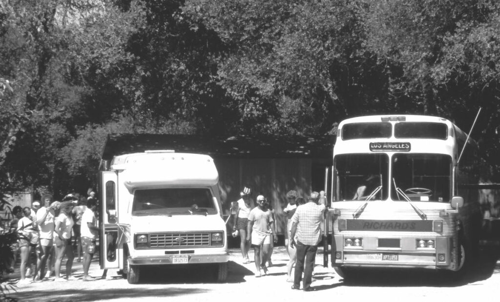 Vintage photo of folks getting on busses